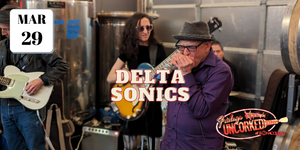 Al Chesis of the Delta Sonics plays harmonica at Bonacquisti Wine Company.