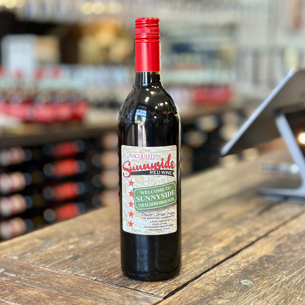 A bottle of Bonacquisti Sunnyside Red sitting on the counter.