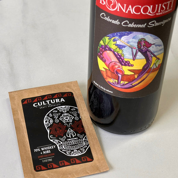 a bottle of Bonacquisti Cabernet Sauvignon paired with Cultura 70% Whiskey and Nibs