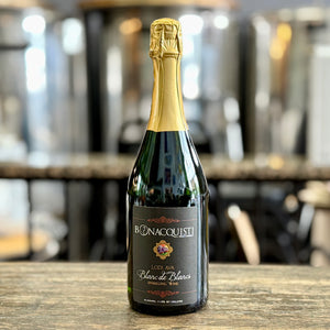 A bottle of Blanc de Blanc, sparkling wine sitting on the bar at Bonacquisti Wine Company