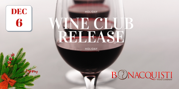 Wine glass with red wine, Christmas decorations, and text about a wine club release.