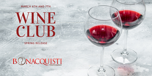 Two wine glasses filled with red wine on a textured surface, promoting Bonacquisti Wine Club Spring Release.