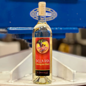 a bottle of Bonacquisti Sauvignon Blanc sitting on a wine press