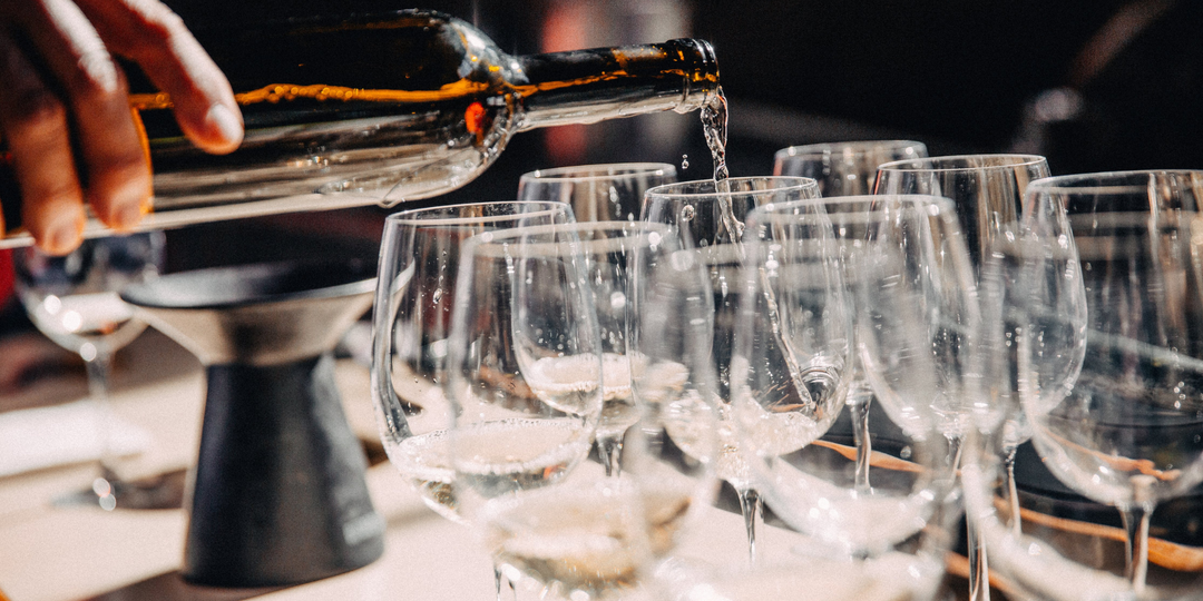 Wine filling glasses at Bonacquisti Wine Co